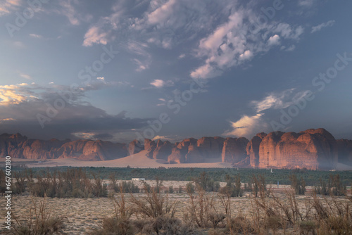 Sunset in AlUla with mountains and palm trees
