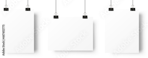 A4 paper page blank posters hanging on paperclip. Realistic mockup 