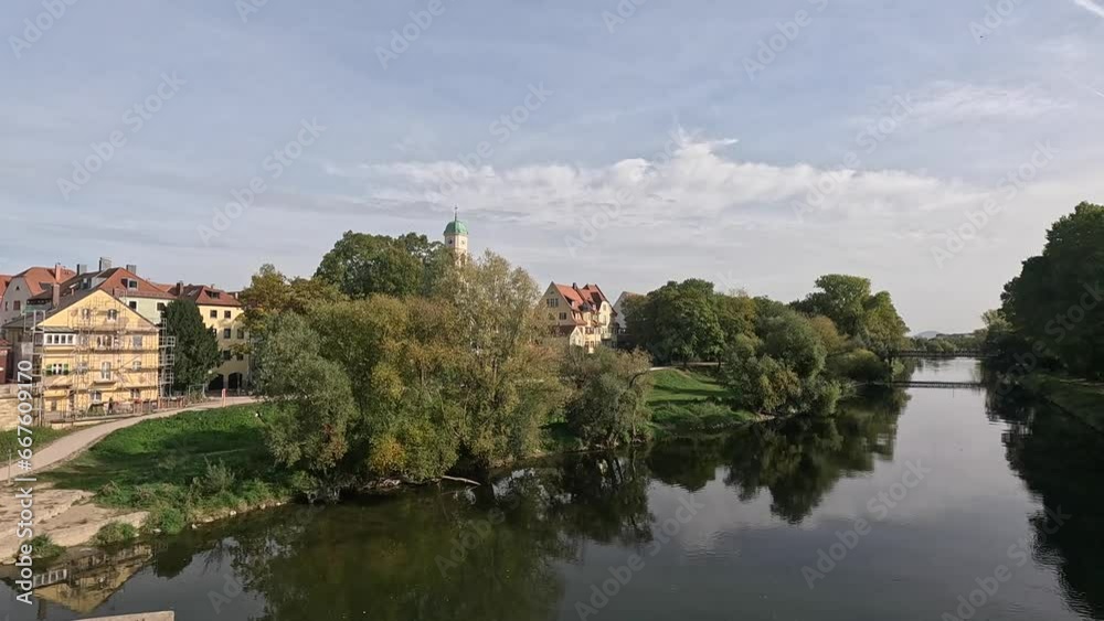 Danube river in autumn with sunshine and clouds in Regensburg Danube river in autumn with sunshine and clouds in Regensburg