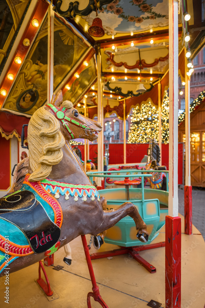 Carousel with colorful horses at the traditional Christmas market
