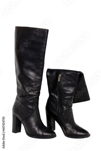 A pair of black elegant female boots or woman shoes isolated on a white background. Leather boots. Clipping path.