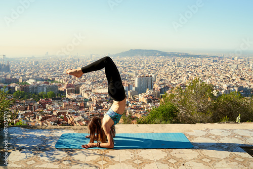 ide view of woman in feathered peacock pose