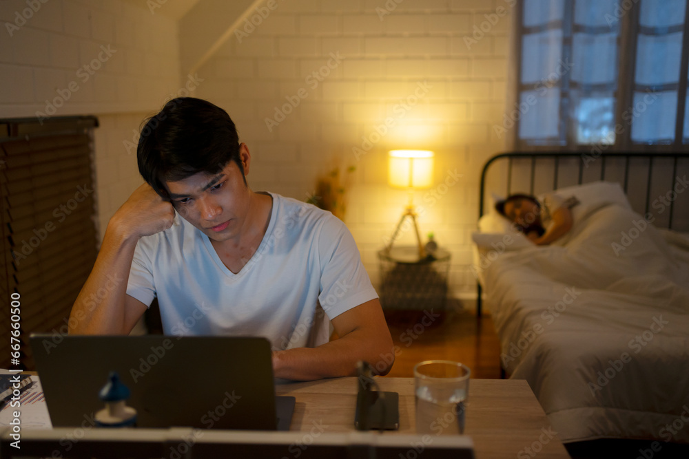 A man is working late at night. A man is working late at night.