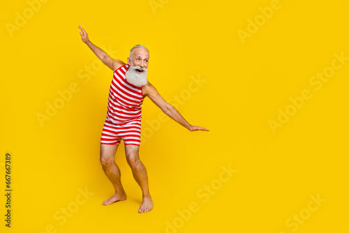 Photography Full length photo of old man surfing ocean waves have fun at resort wearing red