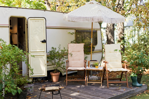 Vintage old travel trailer in garden