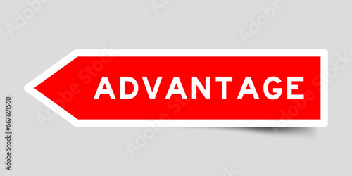 Red color arrow shape sticker label with word advantage on gray background