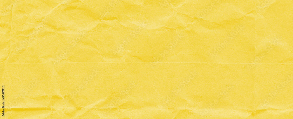 Recycled crumpled yellow paper texture background. Royalty high-quality free stock photo image of Wrinkled and creased abstract backdrop, wallpaper with copy space, top view Recycled crumpled yellow paper texture background. Royalty high-quality free stock photo image of Wrinkled and creased abstract backdrop, wallpaper with copy space, top view