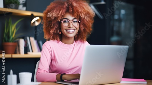 Smiling Adult Black Woman with Pink Curly Hair Photo. Portrait of Business Person in the office in front of laptop. Photorealistic Ai Generated Horizontal Illustration. photo