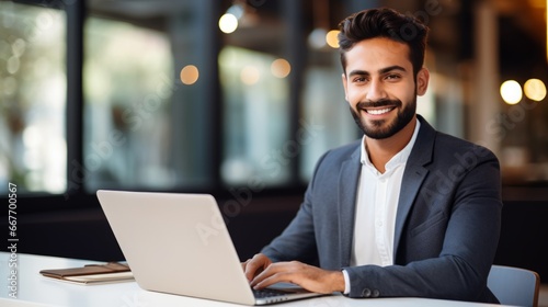 Smiling Adult Persian Man with Brown Straight Hair Photo. Portrait of Business Person in the office in front of laptop. Photorealistic Ai Generated Horizontal Illustration. © Vector Juice