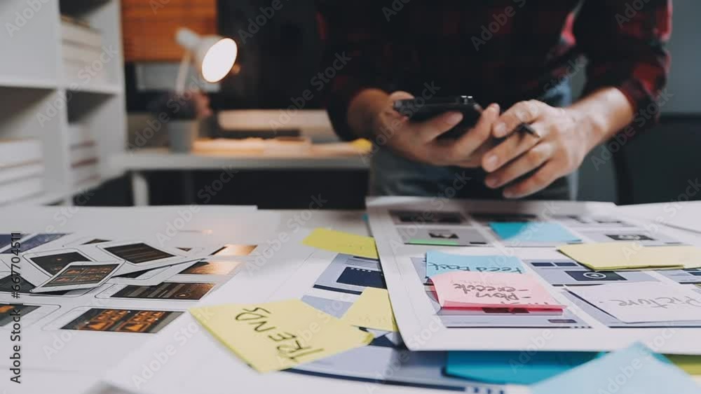 UX graphic designer planning application process development prototype wireframe for web smart phone. Creative digital development agency. in office
