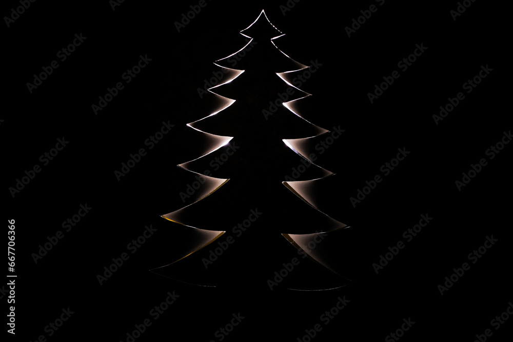Obraz premium Christmas tree shape cut out white paper Creative concept Holiday Xmas card Happy New Year celebration Christmas