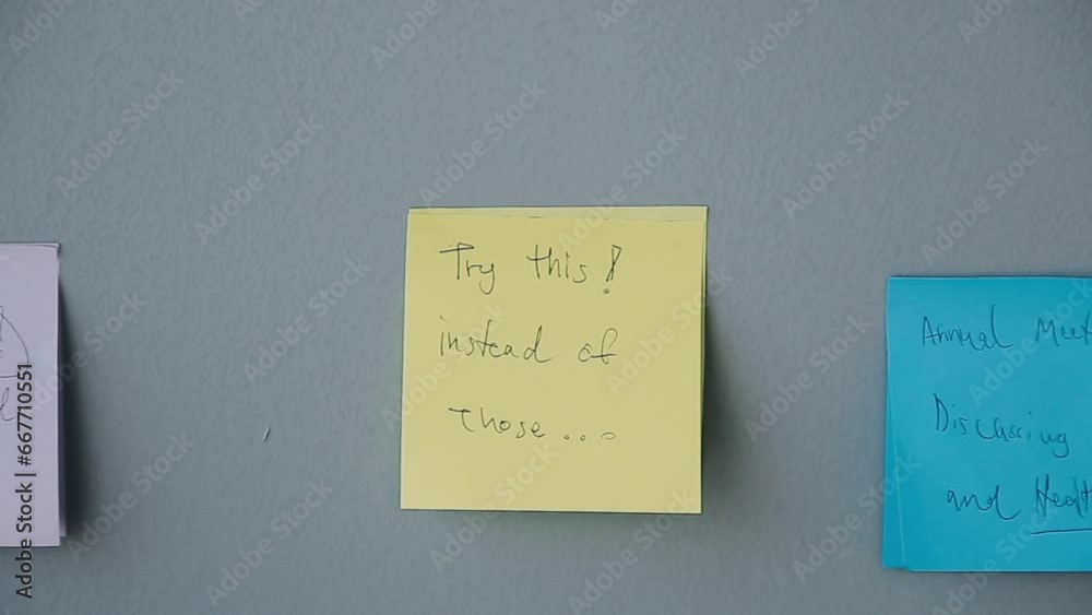 Business people meeting at office writing memos on sticky notes. planning strategy and brainstorming, colleagues thinking concept. Business people meeting at office writing memos on sticky notes. planning strategy and brainstorming, colleagues thinking concept.