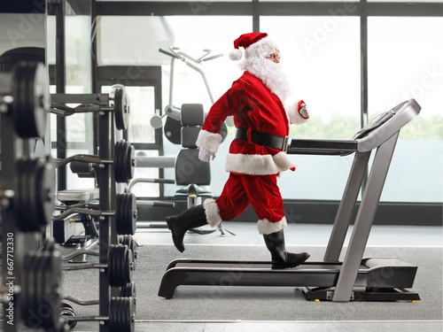 Santa Claus running on a treadmill at a gym