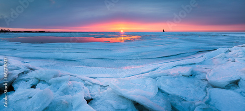 Frozen Bay Sunset in Lewes, Delaware photo