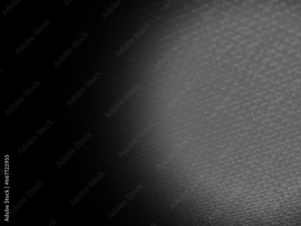 black gray metal texture with light gradient circle at right, abstract degrade background