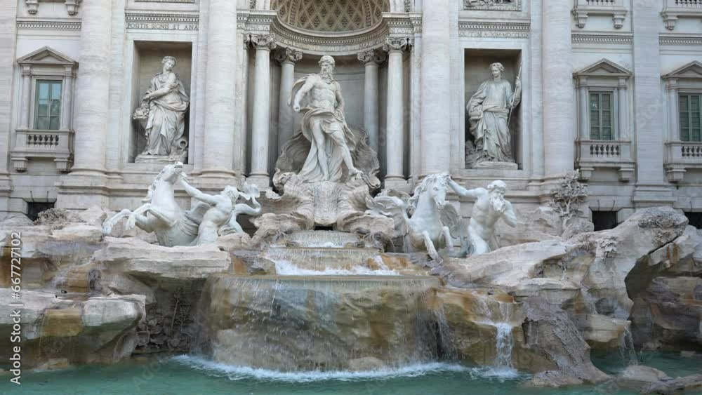 Detail front view of Trevi Fountain in Italian language Fontana di Trevi is fountain in Trevi district designed by Italian architect Nicola Salvi and completed by Giuseppe Pannini, slow motion. Detail front view of Trevi Fountain in Italian language Fontana di Trevi is fountain in Trevi district designed by Italian architect Nicola Salvi and completed by Giuseppe Pannini, slow motion.