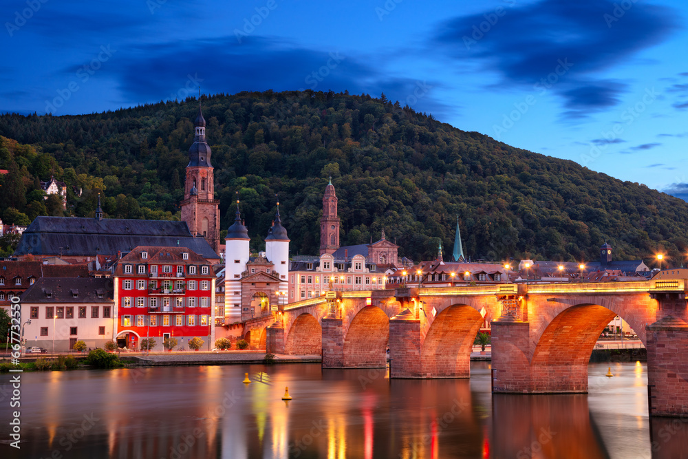 Heidelberg, Germany. Cityscape image of historical city of Heidelberg, Germany with Old Bridge Gate at autumn sunset.