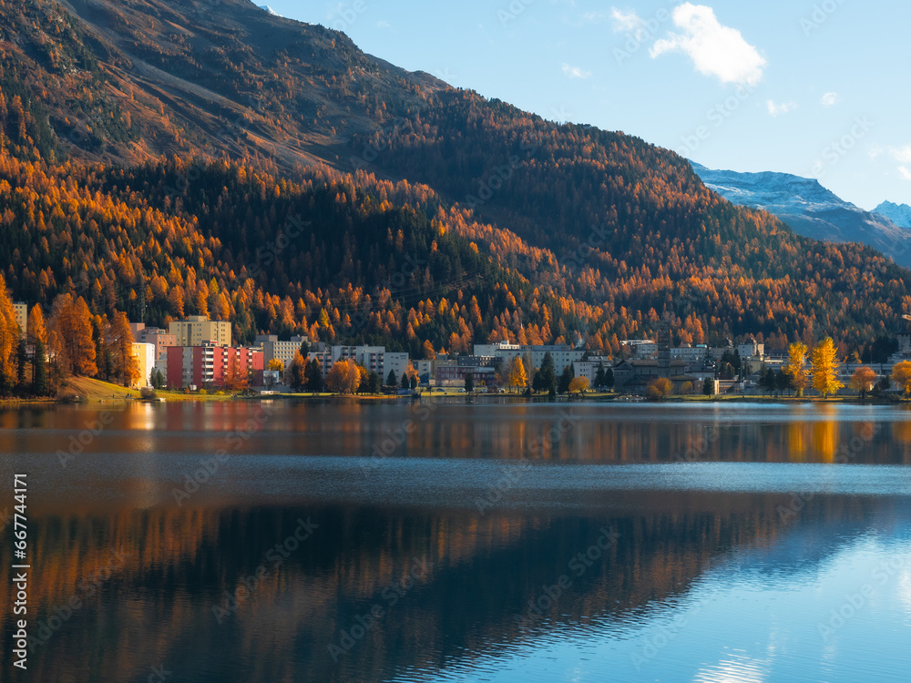 Magnificent autumn atmosphere of St.Moritz, famous and luxury ski resort town, located in the upper Engadin valley in the south-eastern corner of Switzerland. View of St.Moritz lake and luxury resorts