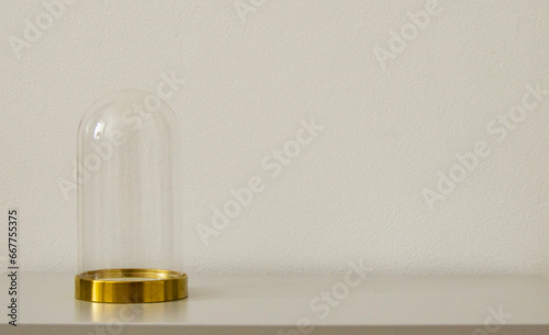 Glass dome on gray background. Crystal case with round golden tray.Empty realistic Christmas container, display or showcase for product presentation.