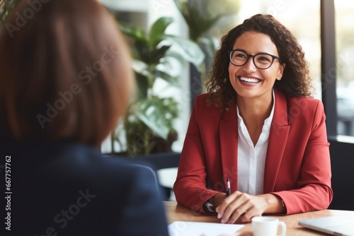 Middle aged professional business woman executive HR manager having job interview or business discussion in corporate office meeting.