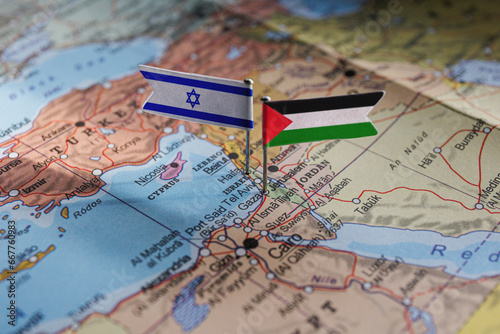 Israel and Palestine flags on geopolitical Map. Gaza strip and West Bank. War conflict photo