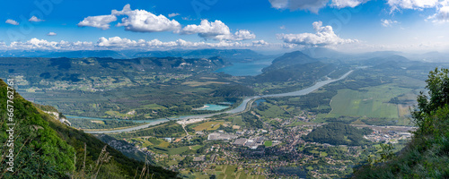 Grand Colombier, France - 08 31 2021: Grand Colombier Pass. View of the forest, the road, the Rhone river, the Lake Bourget, the mountains and Culoz city behind.