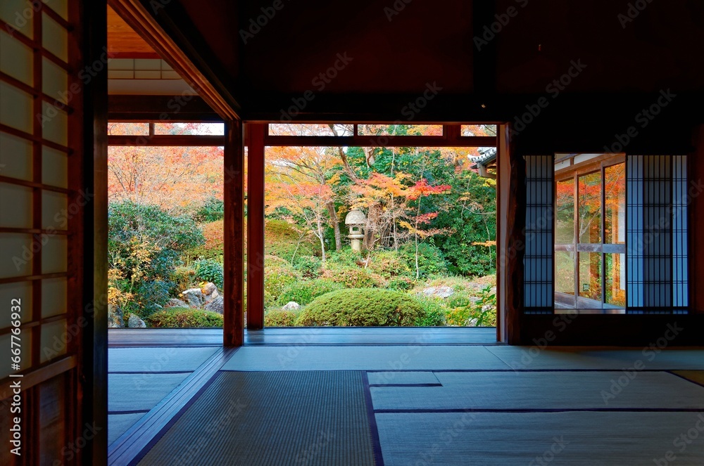 Autumn scenery of colorful maple foliage in a beautiful Japanese garden thru the sliding screen doors ( Shoji ) of a tatami room in Genkoan, a Buddhist temple famous for its Zen garden in Kyoto Japan Autumn scenery of colorful maple foliage in a beautiful Japanese garden thru the sliding screen doors ( Shoji ) of a tatami room in Genkoan, a Buddhist temple famous for its Zen garden in Kyoto Japan
