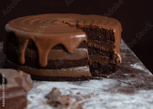 Chocolate cake or brigadeiro cake whole or slice in a white plate