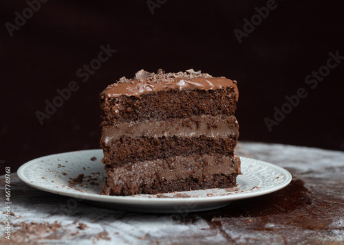 Chocolate cake or brigadeiro cake whole or slice in a white plate