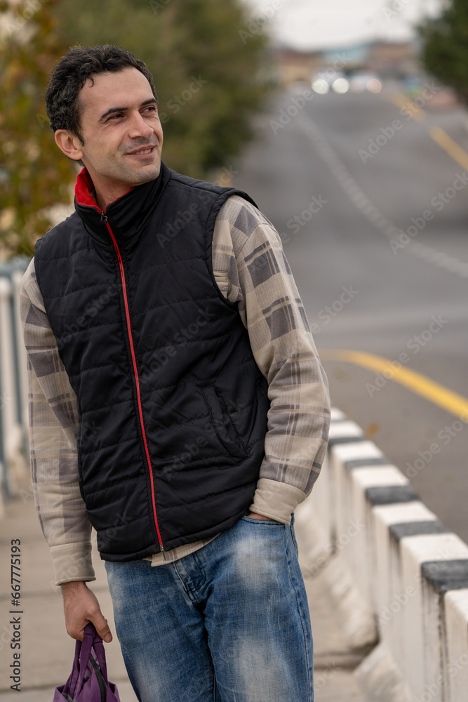 Armenian man, different emotional face actions, in the outdoor, the cold temperature, with the jacket, laughing in the roadside Armenian man, different emotional face actions, in the outdoor, the cold temperature, with the jacket, laughing in the roadside