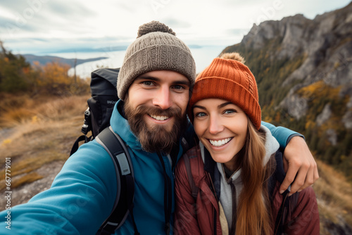 Couple goals. Cropped portrait of affectionate young couple taking selfies while walking in the mountains. naturalism, hiking, mountaineering.