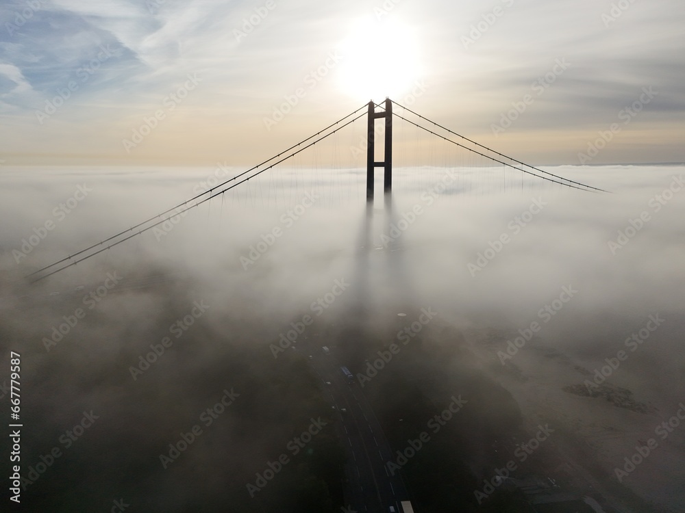 Fototapeta premium aerial view of the Humber Bridge in the morning mist over the river humber