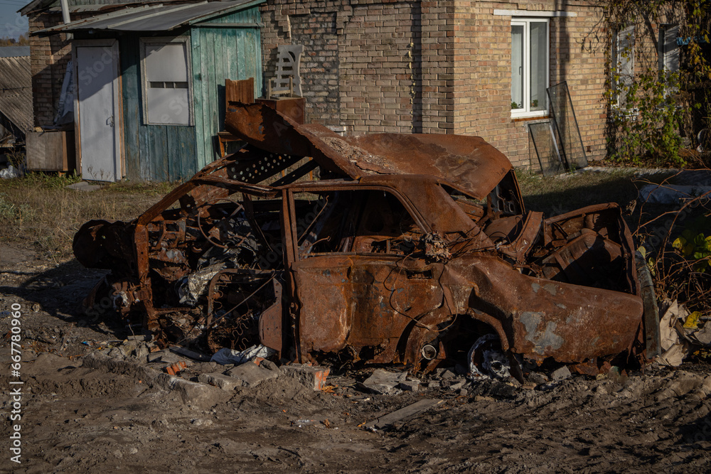 Fototapeta premium Irpin, Ukraine. 21.10.23 : burnt car in total