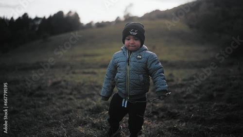Child walking in a valley