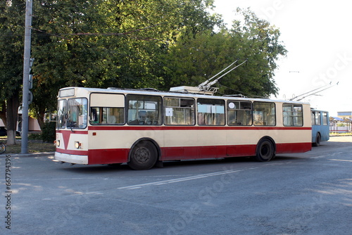 On a summer day there is a trolleybus in the parking lot. ©  DENIS  
