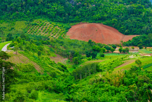 An aerial view of a hill that has been cleared for agriculture in Loei Province, Thailand.