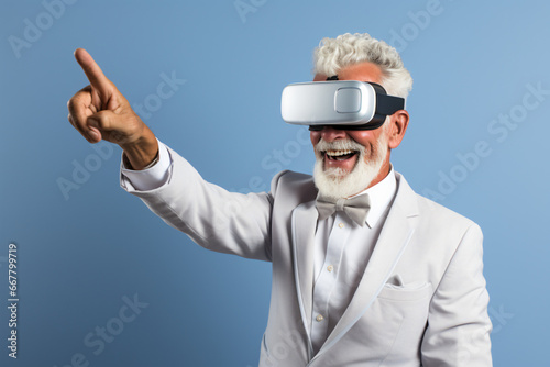 Senior man in suit and modern augmented reality headset interacting with virtual content on plain blue background. Advertising image with bright colors and high-impact volumetric lighting.
