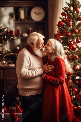 Old man and woman are decorating Christmas tree, grandparents are hugging against the background of the New Year tree, New Year and Christmas