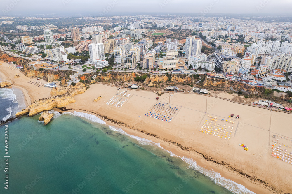 Aerial drone view of Portimao skyline and city beach of Praia da Rocha , Algarve,Portugal