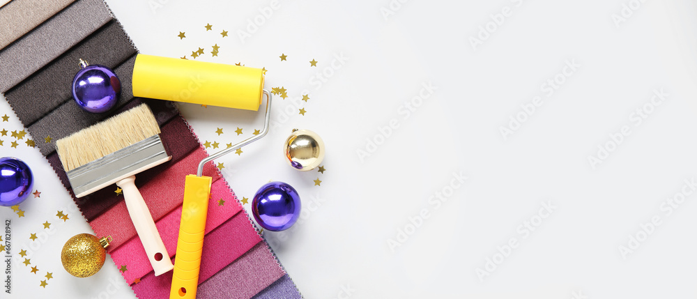 Painter's supplies with Christmas decor on white background with space for text