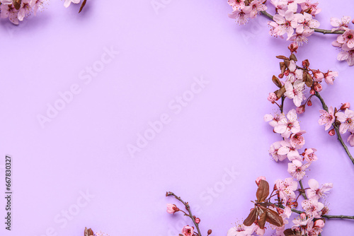 Frame made of blooming branches on lilac background © Pixel-Shot