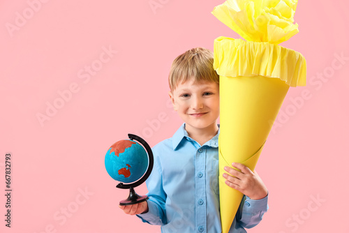 Happy little boy with yello...