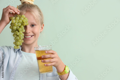 Little girl with glass of j...
