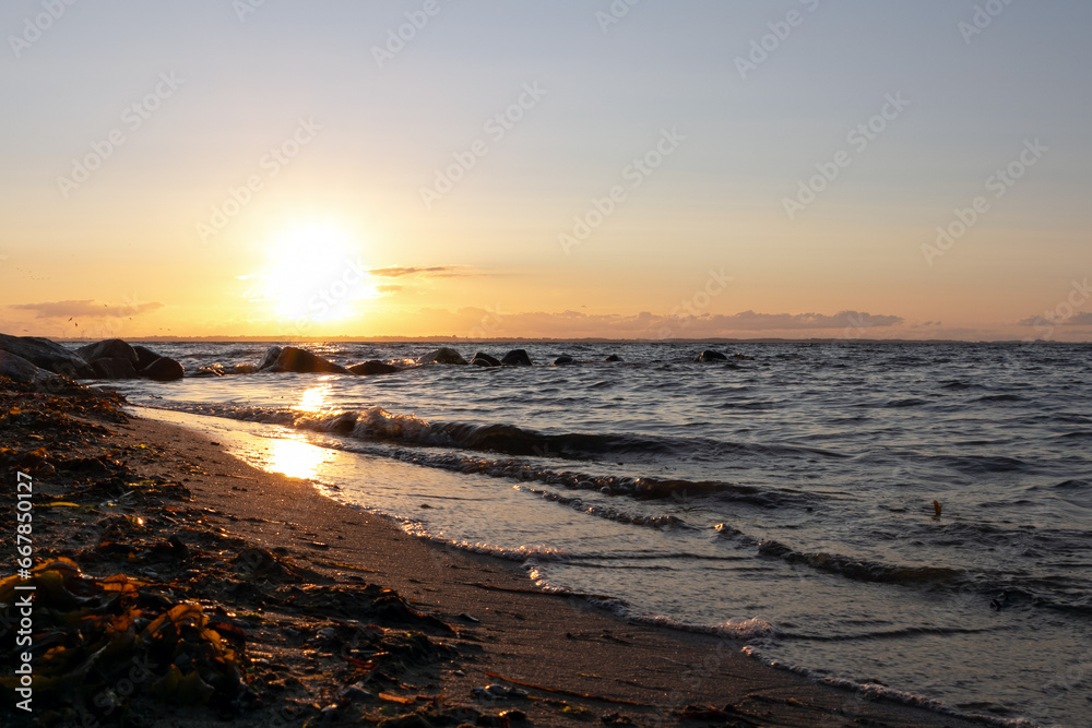Scenic beach scene with drift line at sunset. Scenic beach scene with drift line at sunset.