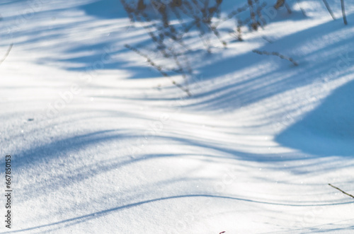 Background photo with shadows on the snow. Simple winter horizontal background