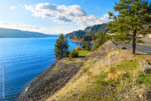 Photos Lake view from the lakefront walking centennial trail at the Coeur d'Alene Parkway State Park at Higgens Point on the lake at autumn, in Coeur d'Alene, Idaho USA