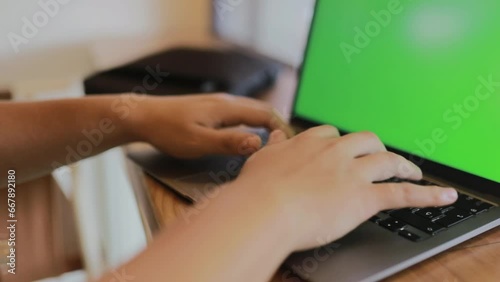 Man typing on his laptop in a cafe social media concept