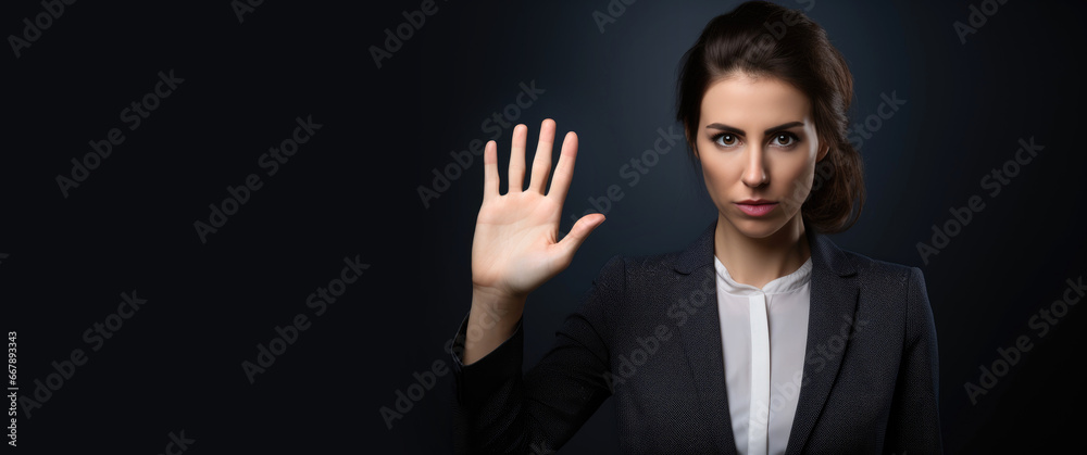 Businesswoman is showing her hand a stop sign Businesswoman is showing her hand a stop sign
