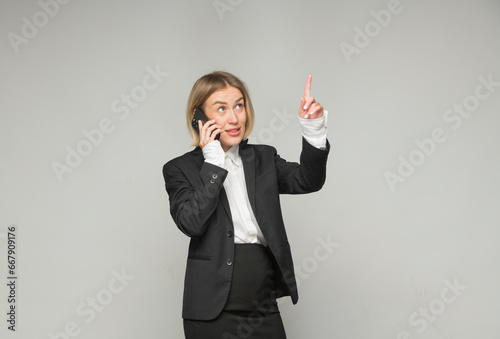 businesswoman talking expressively on smartphone