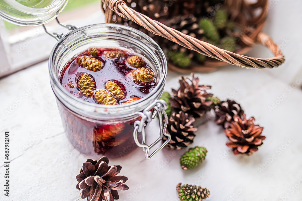 jar of pine cone jam, a gift from nature that can be enjoyed on its own or used to make a delicious and nutritious tea to soothe a sore throat. jar of pine cone jam, a gift from nature that can be enjoyed on its own or used to make a delicious and nutritious tea to soothe a sore throat.